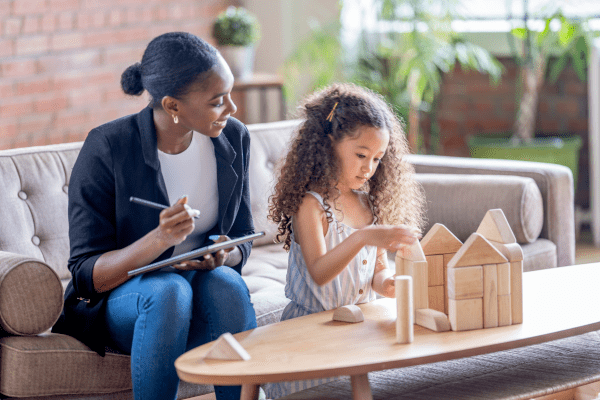 Untitled design - 2024-08-21T144633.333 a child receiving PTSD treatment can work though therapy while playing