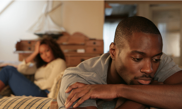 couple in bed not talking