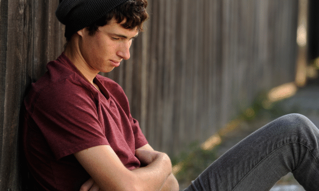 man sitting struggling mental health