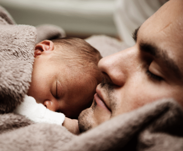 a picture of a father and his baby