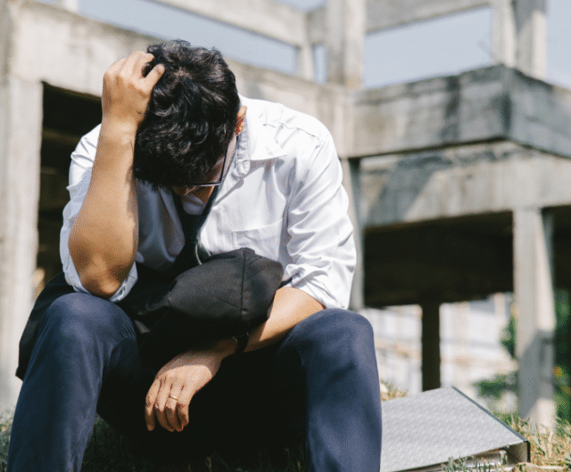 a picture of a stressed guy who just lost his job