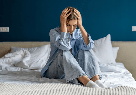 stressed woman in bed