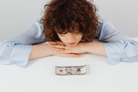 woman looking at money