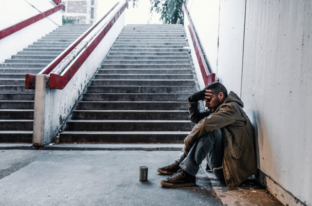unhoused and stressed man